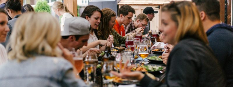 people dining at a busy restaurant table